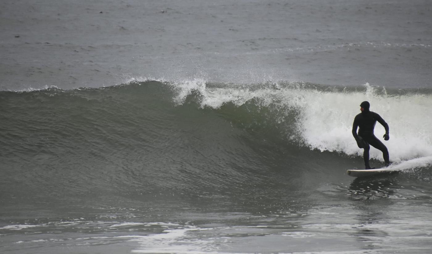 Micah surfing in his home state of Delaware. Photo: Mike Powell